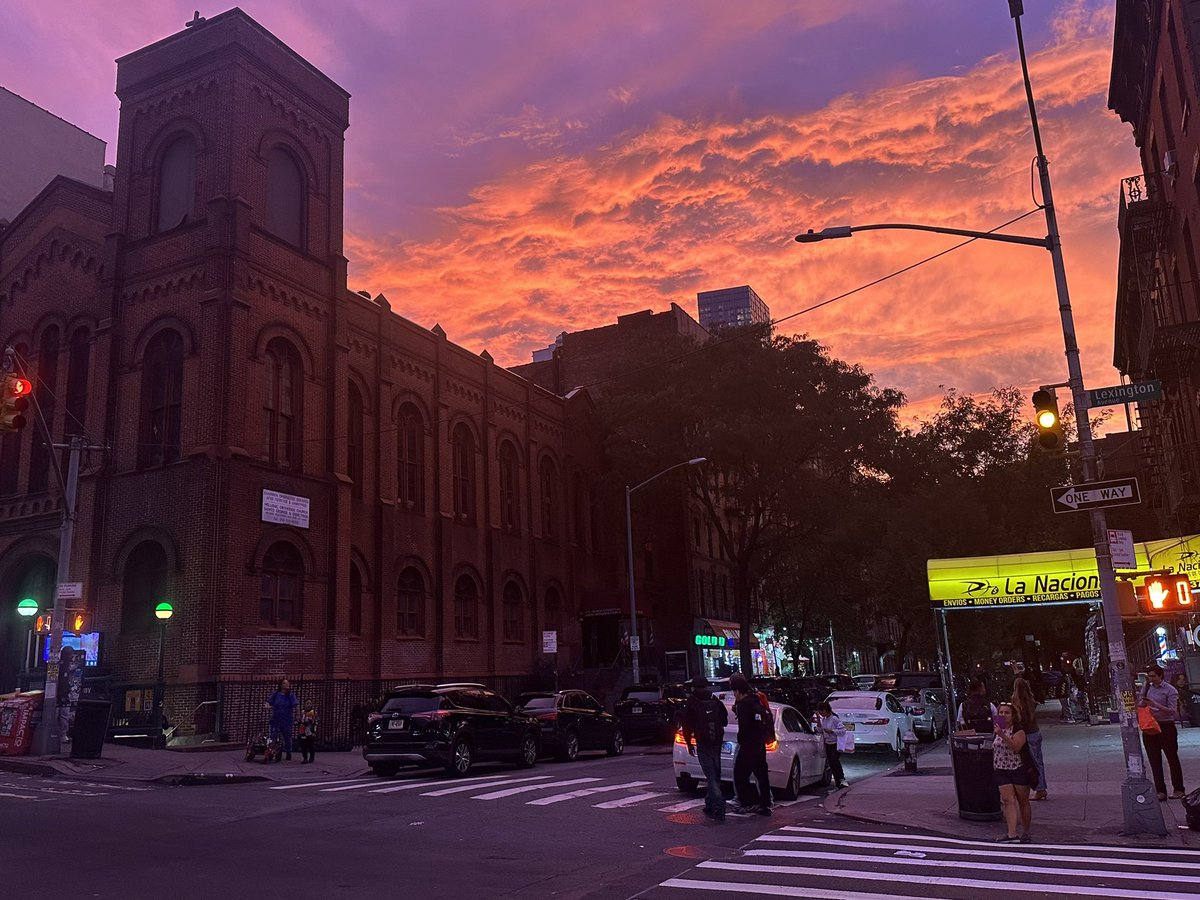 AsadFromNYC's tweet photo. Orange and purple cotton candy skies over East Harlem just now. https://t.co/xh92QQ203l