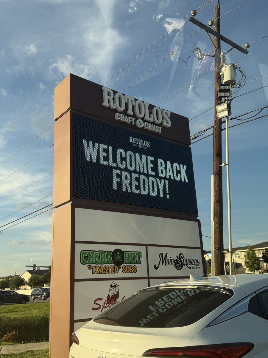 FreddyLA7's tweet photo. We have arrived in Baton Rouge. A little later than expected because we had a small car crash on the way. Nothing serious though, everyone is fine.

On a positive note, we saw this sign welcoming us back to Baton Rouge. I was on my phone when one of my friends suddenly screamed, “I swear to God, that sign just said ‘Welcome back Freddy’.”