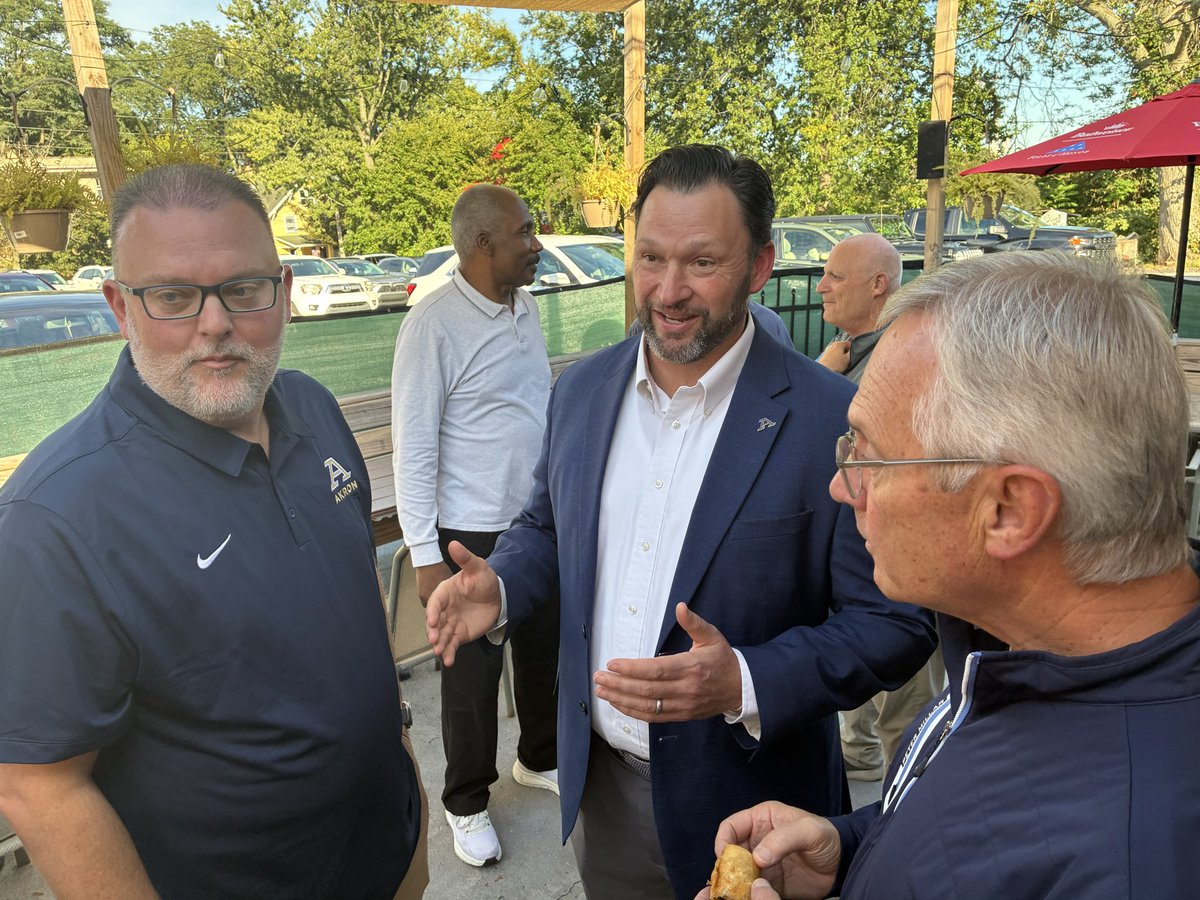 ZipsFB's tweet photo. Two legendary coaches and a director of athletics celebrating a legendary @AkronZips team. Can’t wait to see them all at ICS tomorrow!

#GoZips 🦘 #MakeTheClimb https://t.co/2fs20w7Ce6