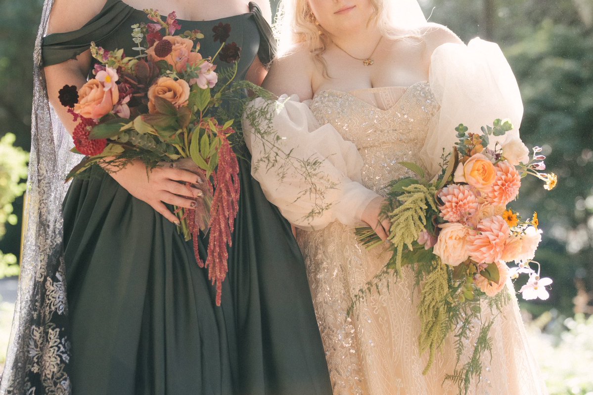 clammyheart's tweet photo. our big beautiful trans/lesbian wedding where we got to look like princesses ❤️‍🔥 https://t.co/7grAXUn02W