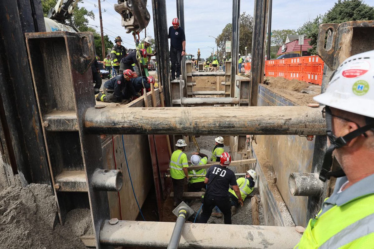 IFD_NEWS's tweet photo. the trench. The Gradex Vac Truck, and workers were vital to the successful completion of this mission.  IFD crews worked in partnership with the Gradex crews to monitor for safety and address removal needs.  As Gabriel was able, he assisted rescuers with removing dirt from https://t.co/z7foOtuTym