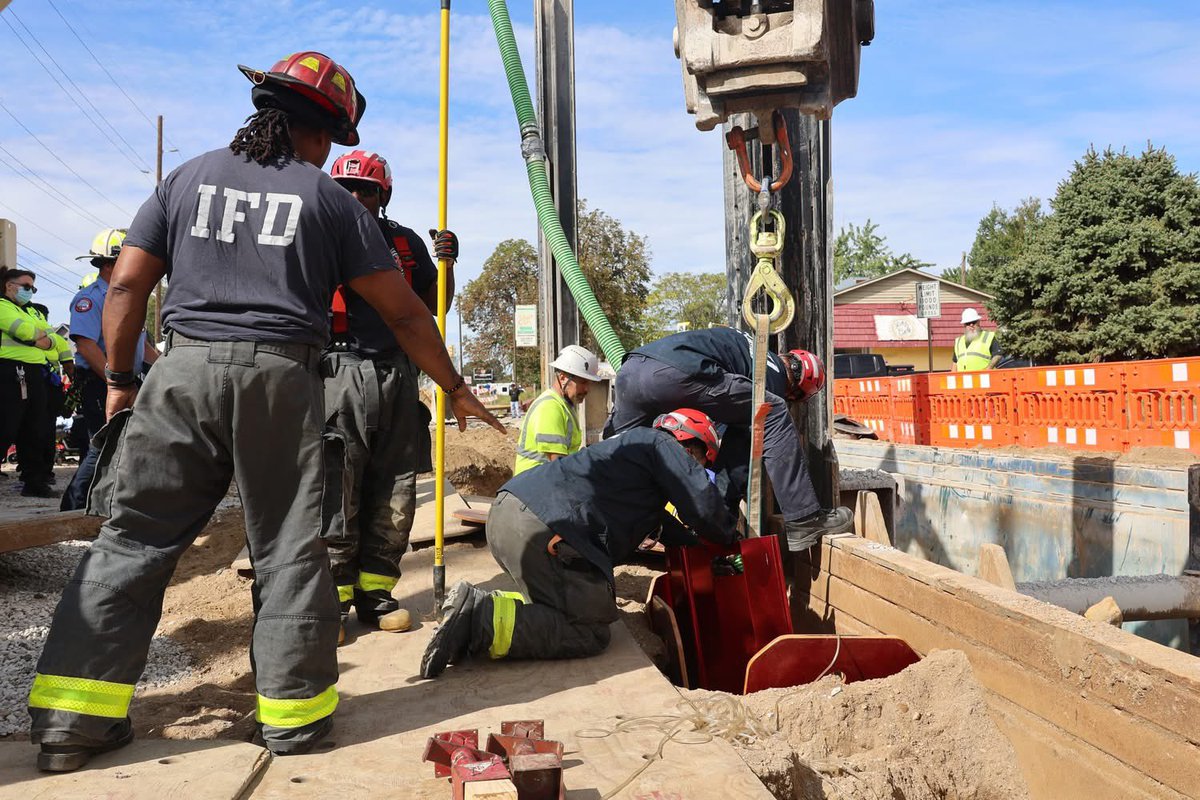 IFD_NEWS's tweet photo. the trench. The Gradex Vac Truck, and workers were vital to the successful completion of this mission.  IFD crews worked in partnership with the Gradex crews to monitor for safety and address removal needs.  As Gabriel was able, he assisted rescuers with removing dirt from https://t.co/z7foOtuTym