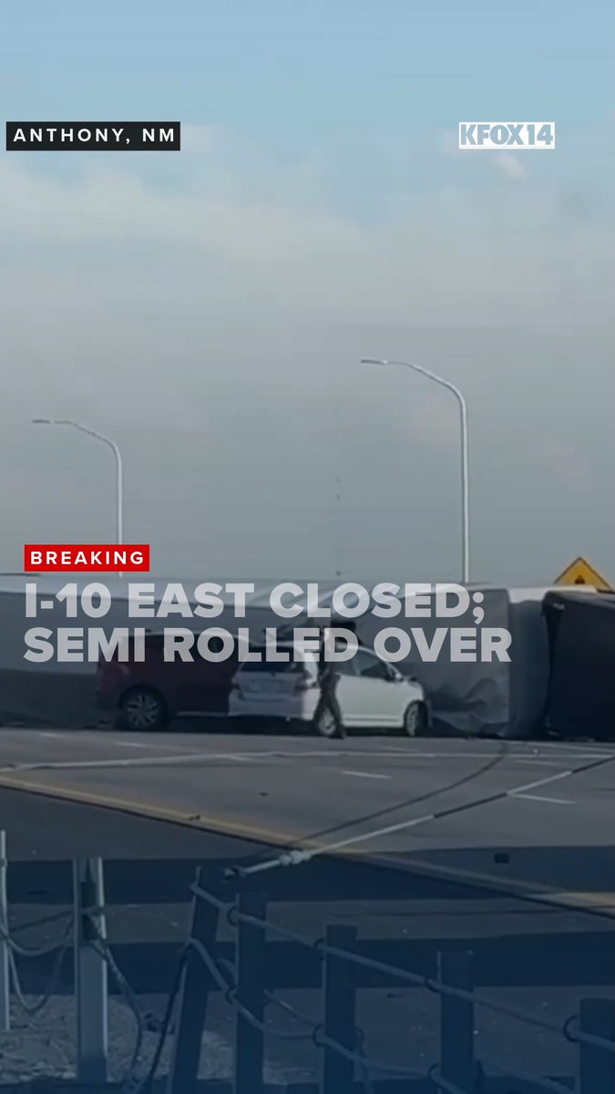 News screenshot from KFOX14 showing a rollover accident on I-10 East in Anthony, NM, with a semi-truck on its side and a person walking near a white car.