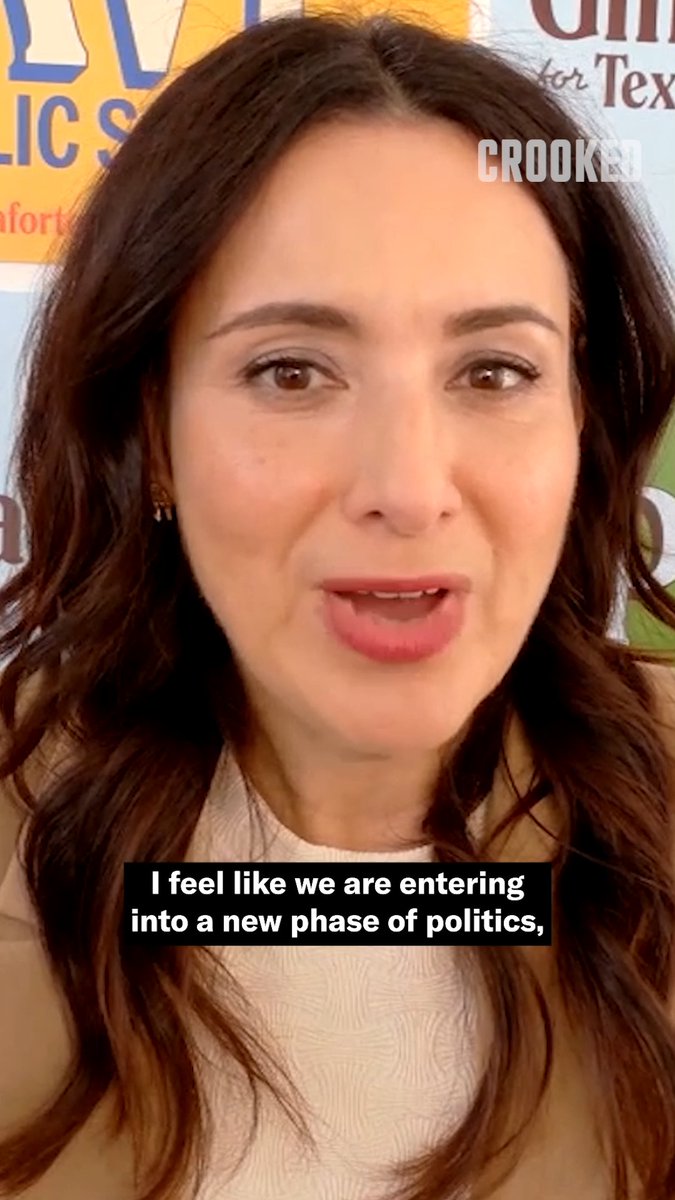 Gina Hinojosa speaks in front of political posters with on-screen text reading "I feel like we are entering into a new phase of politics," as she comments on ideological support she's receiving in Texas.