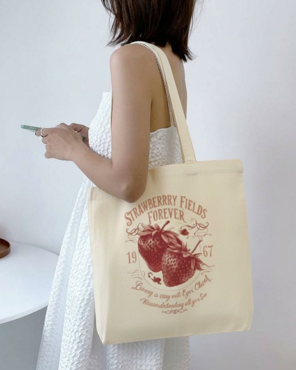 lucasberlin1's tweet photo. Soft days, sweet moments, and vintage charm. Our Strawberry Fields tote is perfect for morning walks, coffee dates, market trips, and slow study days. Made for those who romanticize the little things. Available now. https://t.co/bKegdQWnLU