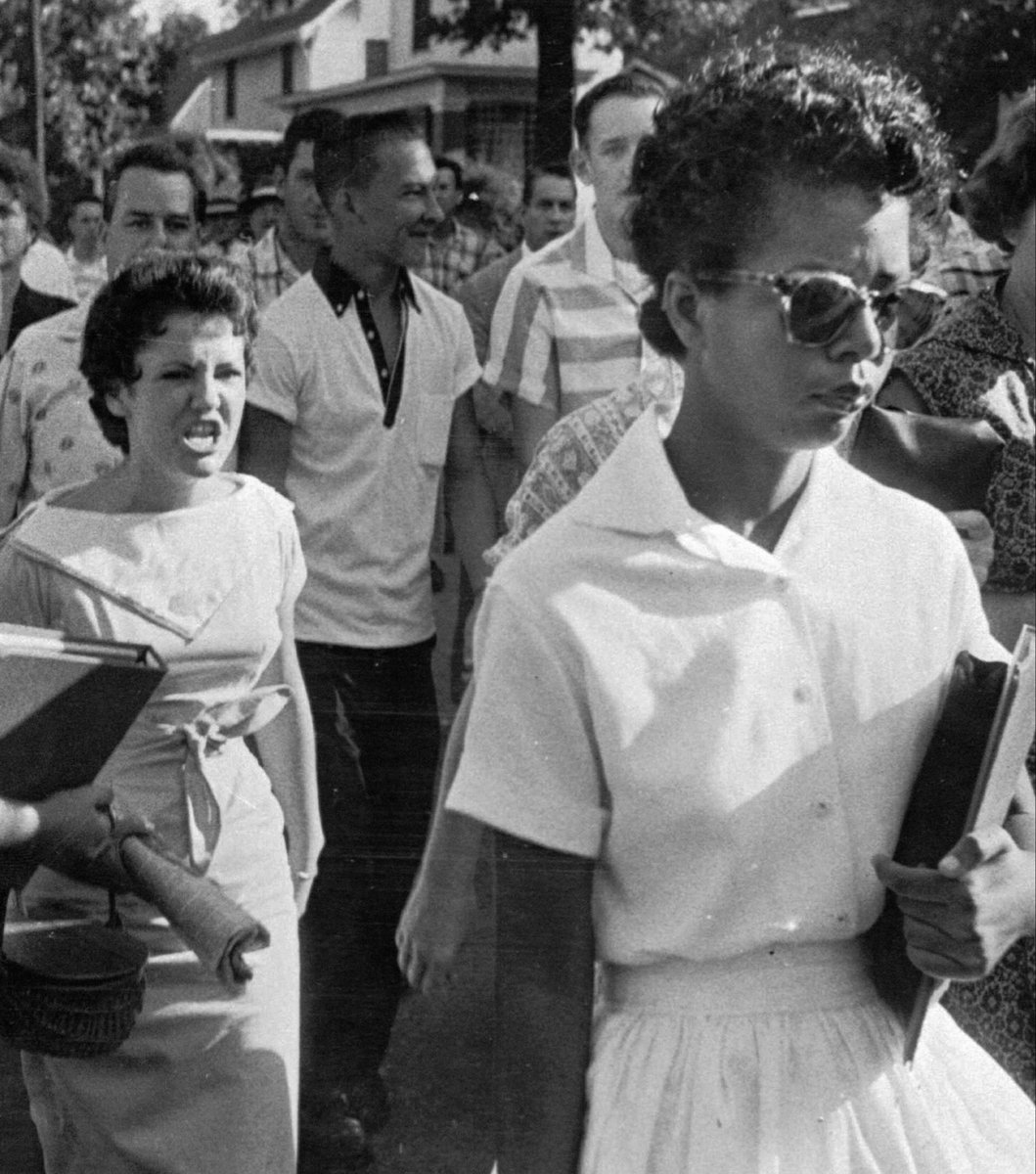Kdoespolitics's tweet photo. 69 years ago today the 101st airborne escorted African American students into Central High School, angry segregationist crowds screamed and spat on the students as they entered.

On the right, Darializa celebrates her arrest along with celebrities for her protest at the UN. https://t.co/0vK7UbwaAC