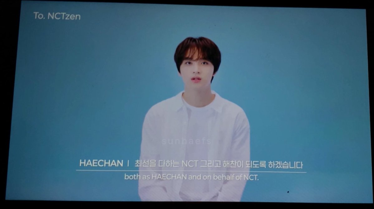 A young man, identified by on-screen text as HAECHAN, stands against a light blue background wearing a white button-up shirt, addressing NCTzen (NCT fans) with the caption "To. NCTzen" in the upper left corner. The image appears to be a screenshot from a heartfelt video message, with bilingual subtitles reading "both as HAECHAN and on behalf of NCT," connecting to his 10th anniversary tribute to the fanbase.