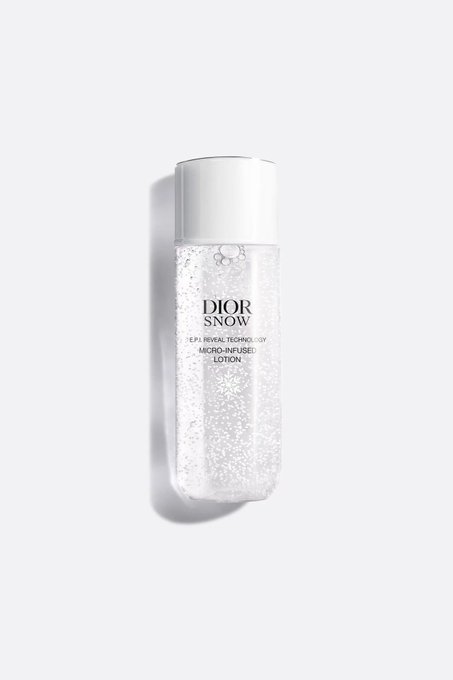 A bottle of Dior Snow Micro-Infused Lotion displayed against a clean white background.