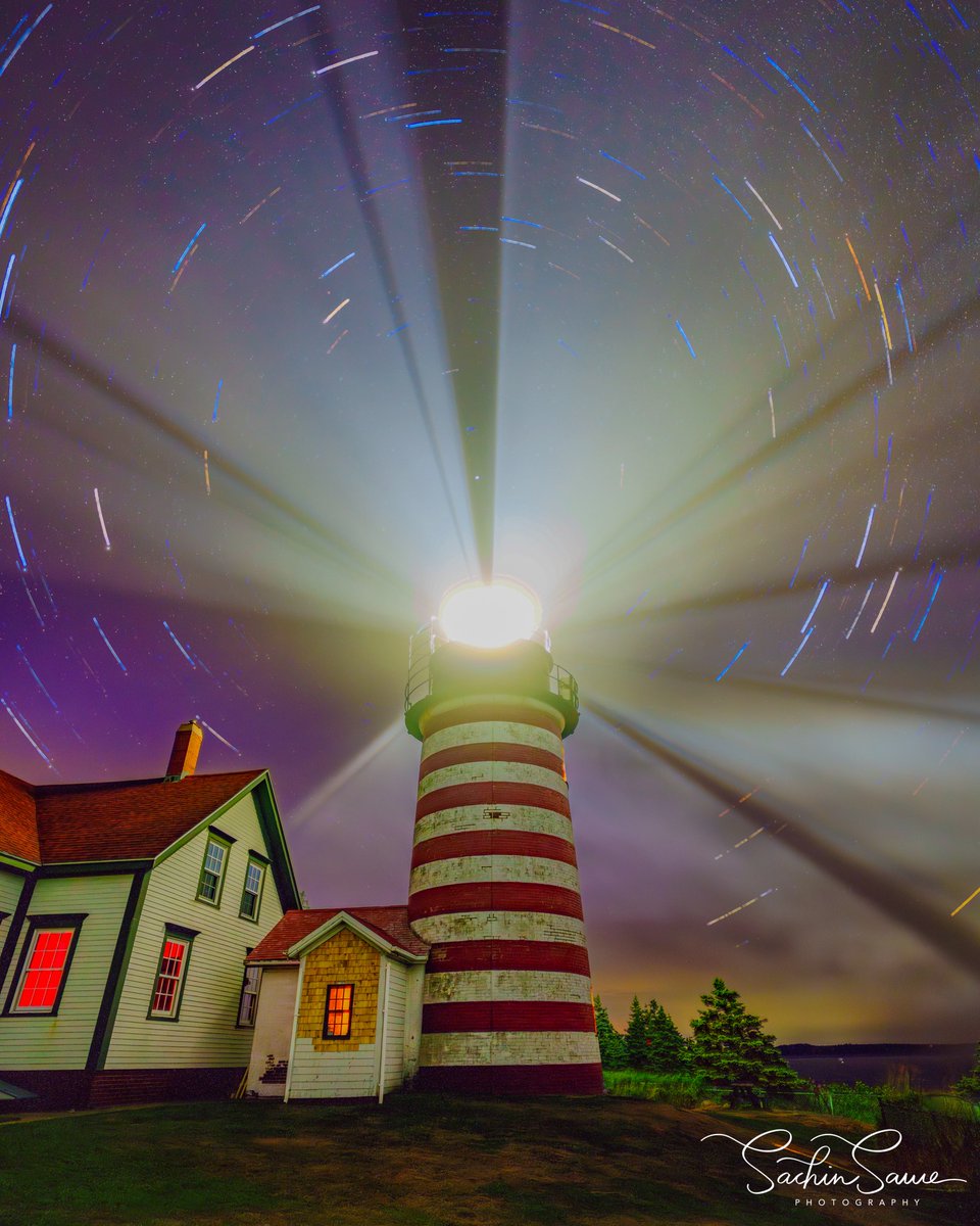 ColeneHaulu0y's tweet photo. Guiding the way beneath a sky full of stars. Happy National Lighthouse Day! I captured this at West Quoddy Head Light in Maine, the easternmost lighthouse in the United States. Lighthouses are more than beautiful landmarks—they symbolize guidance https://t.co/qUdq7qGMmS