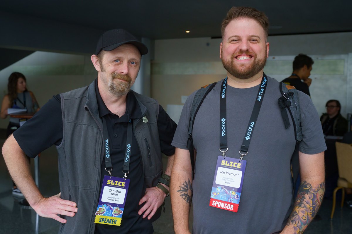 Serellan's tweet photo. Oh hey, got the photo drop from the @SeattleIndies #SLICE conference!

Here's me talking cool gamedev stuff with cool folks.

Shoutout to @Xsolla @joepierpont @Lost_Cartridge and everyone else! https://t.co/ybskbM2dLb