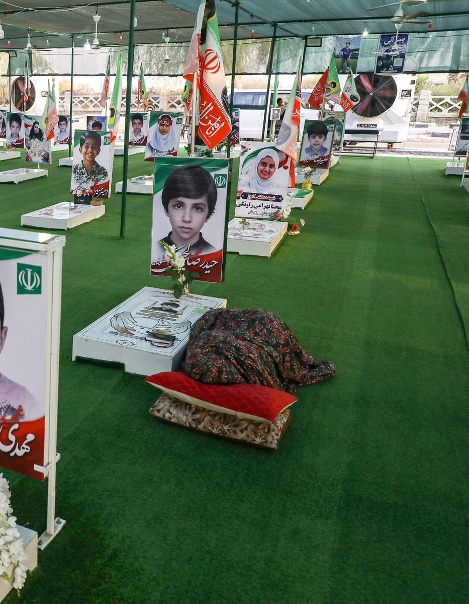 IraninSA's tweet photo. The legacy of the world's most moral army: a mother who sleeps beside her child's grave every night so he won't be alone.💔 https://t.co/ygfB0nuFDm
