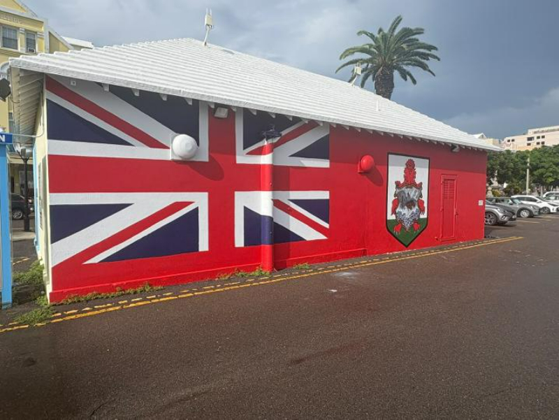 bernewsdotcom's tweet photo. The Bermuda flag mural at No. 1 Car Park on Front Street, originally created in 2015, has been restored | Read more: https://t.co/ClyRFuVQMw https://t.co/pLrGlWCYz8