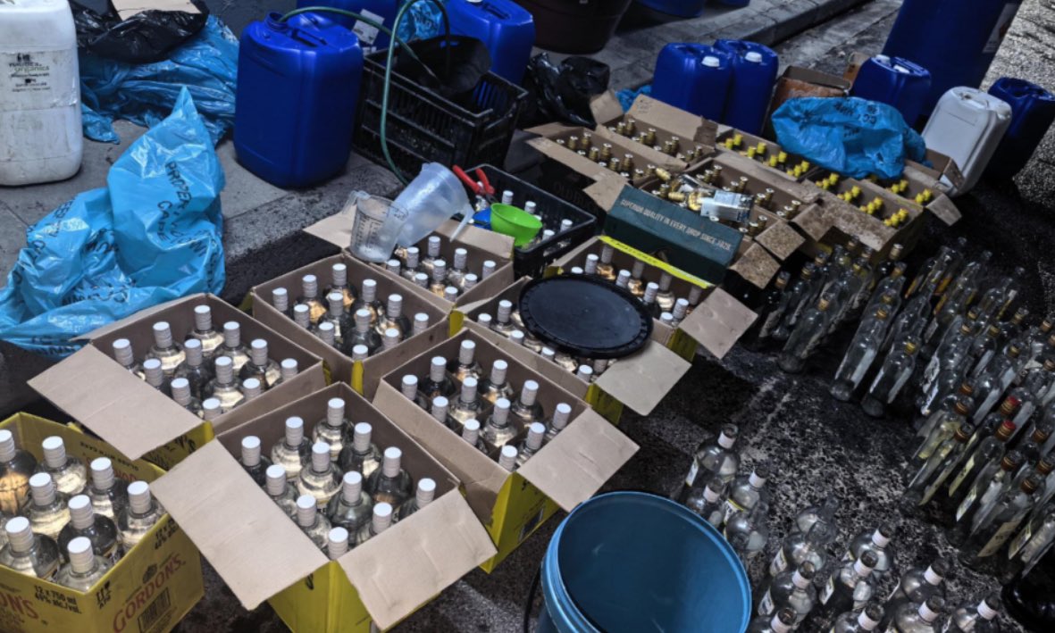 JvanLogg's tweet photo. The illicit alcohol market in South Africa has expanded from an opportunistic underworld hustle into a highly sophisticated R25.1 billion (annual tax loss R16.5 billion) parallel shadow industry.

The scams: 
 1. Syndicates obtain discarded/fake bottles of popular whiskies, brandies and vodka. These are refilled with cheap, unregulated industrial ethanol or toxic methanol and then resealed using counterfeit caps, labels, and cloned excise stamps, and reintroduced directly into unverified retail pipelines. Methanol toxicity poses fatal health risks, causing permanent blindness, organ failure, or death. 

2. Some are of these “poison liquor” products are unknown brands or made up brands sold as cheap alternatives. 

3. Unscrupulous producers legally manufacture products but intentionally under-declare or misclassify their true production volumes to the South African Revenue Service (SARS). By filtering thousands of litres of pure alcohol into the market off the books, they completely bypass excise duties. 
 4. Contraband and raw ingredients cross borders untaxed. 

5. Transit diversion: high-proof ethanol is imported under declaration that it is "in transit" to neighboring African nations. Because it is marked for export, no local duties are paid. Syndicates then illegally offload and divert the chemical into South African warehouses to blend backyard spirits.

Between 1994 to 2014, the illicit portion of the alcohol industry hovered at 10% to 13%. This translated to an annual loss of around R2.5 billion. 

During this period, SARS ran a specialised project pressuring the major syndicate involved. In a major judicial precedent, Peter Haupt, was criminally prosecuted in the Johannesburg Magistrate's Court for violating the Customs and Excise Act after SARS teams discovered he had tampered with and broken the official revenue seals to continue illicit bottling off the books. 

SARS also conducted investigations into special duty free shops in Gauteng. This project was disrupted from 2014 onwards as enforcement at SARS was dismantled. 

While the legal alcohol market grew, SARS’s real excise tax revenue collections also began to stagnate and drop significantly relative to market size between 2015 and 2018.

By 2017, Euromonitor International pinned the 2017 illicit market share at 15%, translating to annual tax losses of R4.6 billion. 

By 2019, the estimated parallel market was at R12.9 billion and annual tax loss estimated at R6.4 billion. It reflects an illicit economy that had expanded due to the State Capture purges at law enforcement agencies and SARS. 

During the Covid Lockdown and total ban of alcohol in 2020, the illicit marked peaked at an estimated 22% translating to R20.5 billion and an annual revenue loss of R11.3 billion. 

2019-2024: The alcohol project was reignited in 2019 when SARS reconstituted enforcement capacity. Of 6 suspect operations, 5 were shut down by SARS and a loss of around R100 million per month was stopped. 206 diplomats were implicated and many were expelled by government. 

In 2025, the illicit part was estimated at 18%, translating to R25.1 billion, with an estimated R16 billion annual tax loss. 

2025: Bronkhorstspruit: SARS and SAPS bust workers actively decanting a 40,000-litre tanker of high-proof ethanol - falsely earmarked for export to Zimbabwe - into distribution flow-bins to produce illegal liquor locally. The operation uncover 92,000 litres of illicit ethanol and illegal fuel-adulteration facility, dealing an R11 million blow to the syndicate.

2025: Midrand: Hawks uncover illegal manufacturing facility and distillery in Midrand, seize R2 million worth of illicit alcohol already packaged under cloned, commercial brand labels.

2026: Kempton Park: SARS, SAPS & Hawks intercept 26,000-litre consignment of 96% pure imported ethanol, preventing R9.1 million tax loss.

2026: Plankenburg: SAPS, Western Cape Liquor Authority &  SARS raid confiscated illicit liquor valued at R12 million.
