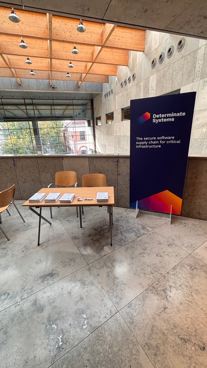 DeterminateSys's tweet photo. If you’re at NixCon 2026 in the lovely Kraków 🇵🇱, we have a booth! Several of us will be camped out here throughout the conference, so don’t hesitate to come say hello and talk anything Nix, supply chain, Linux, and much more. https://t.co/tif62fd3W1