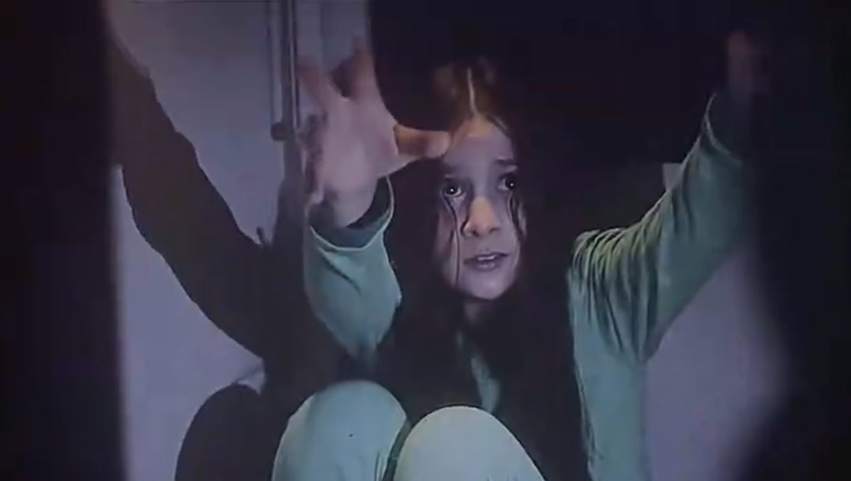 Daykerpriest's tweet photo. One thing I’m yet to understand about the Resident Evil 2026 movie is Bryan’s stupidity in this scene. He knew she was infected, he could clearly see it, and he still went ahead to try to carry her. Like, even if Zack Cregger wants to portray Bryan as dumb, there’s an extent to which one can be dumb. He saw that same thing earlier absorb another person, and what went through his mind was that it wasn’t going to happen to him. I’m not one to backlash at a movie or a character, but this one really got on my nerves!🤧 #ResidentEvil