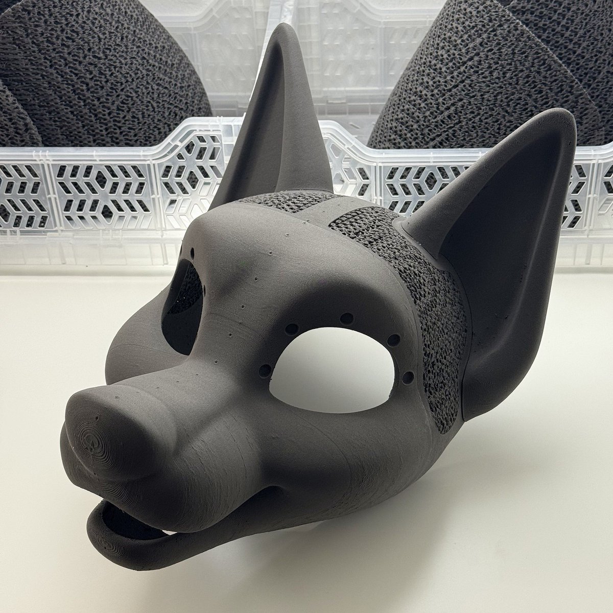 FurAndAsh's tweet photo. Our canine V2 is out! 
Same shape, now lighter and sturdier at ~350 g with ears, with no PLA in the base. Built-in magnet holes, fan-ready vents, and a rear strap option.

https://t.co/PEmsuAl7KQ 

#furry #fursuit #fursuitmaker https://t.co/LDAg1o7iHj