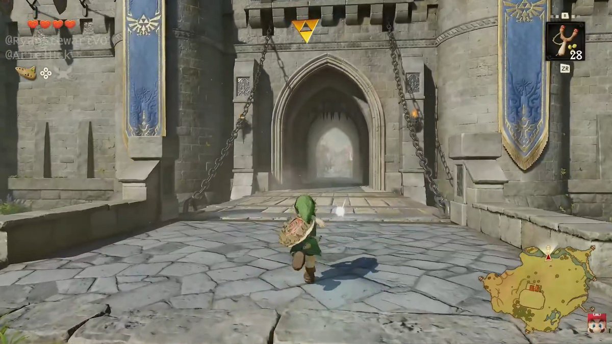 Gameplay screenshot from The Legend of Zelda: Tears of the Kingdom showing the character Link running toward a Hyrule Castle entrance flanked by blue banners, with a Triforce symbol above and a minimap in the bottom right corner.