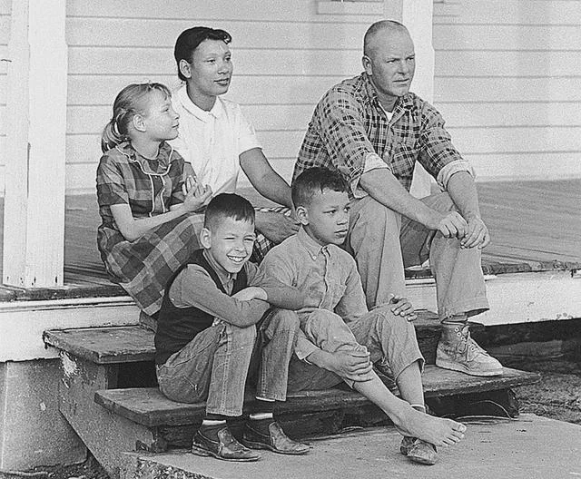 Rainmaker1973's tweet photo. In 1958, they were arrested in their bedroom and exiled from Virginia just for being married. 

Nine years later, Richard and Mildred Loving relaxed on their porch after winning the Supreme Court case that legalized interracial marriage across America. https://t.co/O8JpP9qY6q