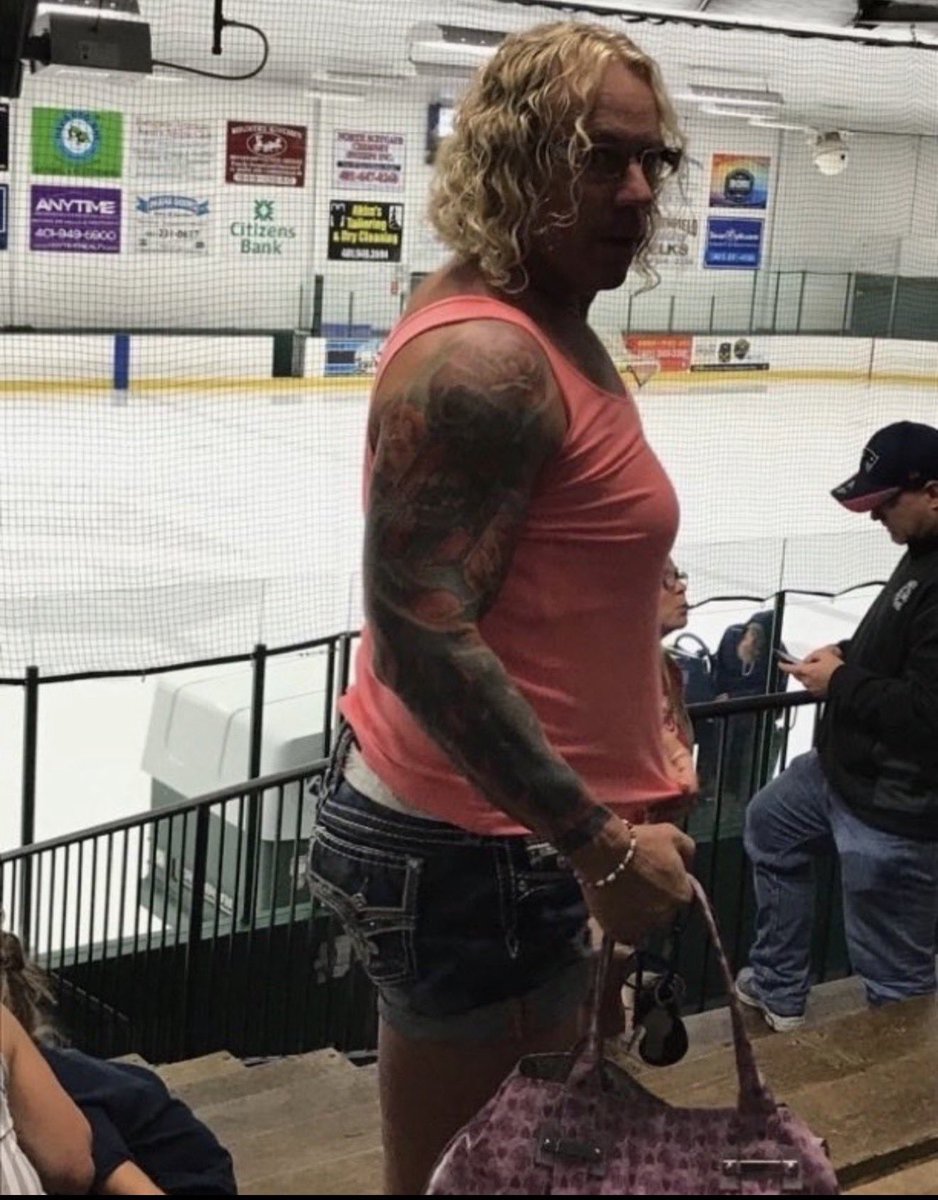 sappholives83's tweet photo. This is a picture of Robert Dorgan on February 16, 2026. 

Moments after this photo was taken, Dorgan opened fire at a hockey game in Rhode Island, killing his ex wife, their son, and her father, and injuring two others before bystanders intervened. In the ensuing struggle, he took his own life. 

The day before the shooting, Dorgan made a post to X stating that violence is an understandable response to anti-trans rhetoric. His own desire to transition had been the catalyst that ended his marriage;  it had also caused significant estrangement between himself and his adult son. 

From the look on his face, the person who took this photograph had a pretty narrow escape.