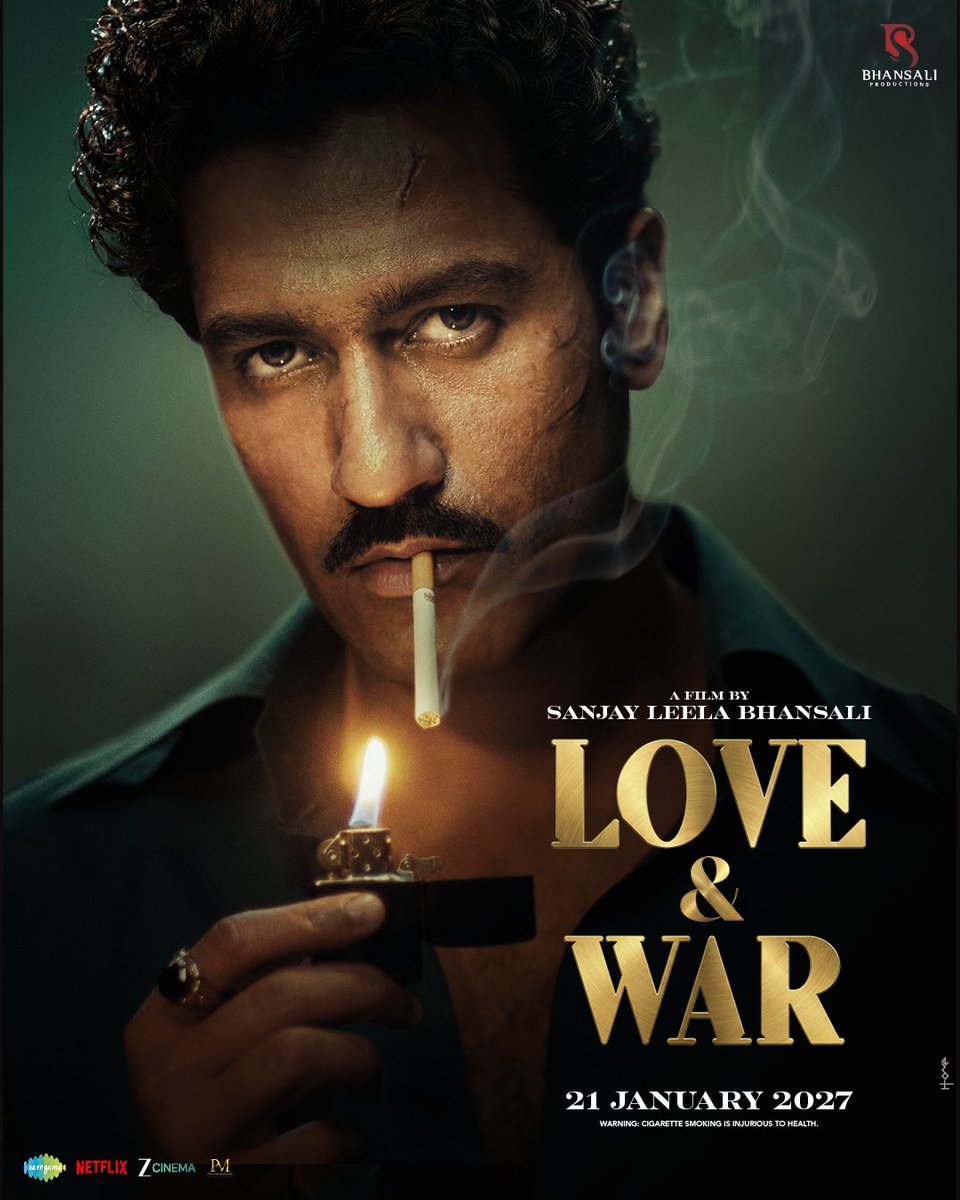 AlwaysBollywood's tweet photo. #VickyKaushal gets into the skin of another powerful character after #URI, #Sanju, #Masaan, and #SamBahadur. 

In #SanjayLeelaBhansali’s #LoveAndWar, the actor’s persona drips with swag and style in his first look. 

This is a completely different avatar of Vicky, and the mystery surrounding his character makes the first look even more exciting. The film is releasing on January 21, 2027.