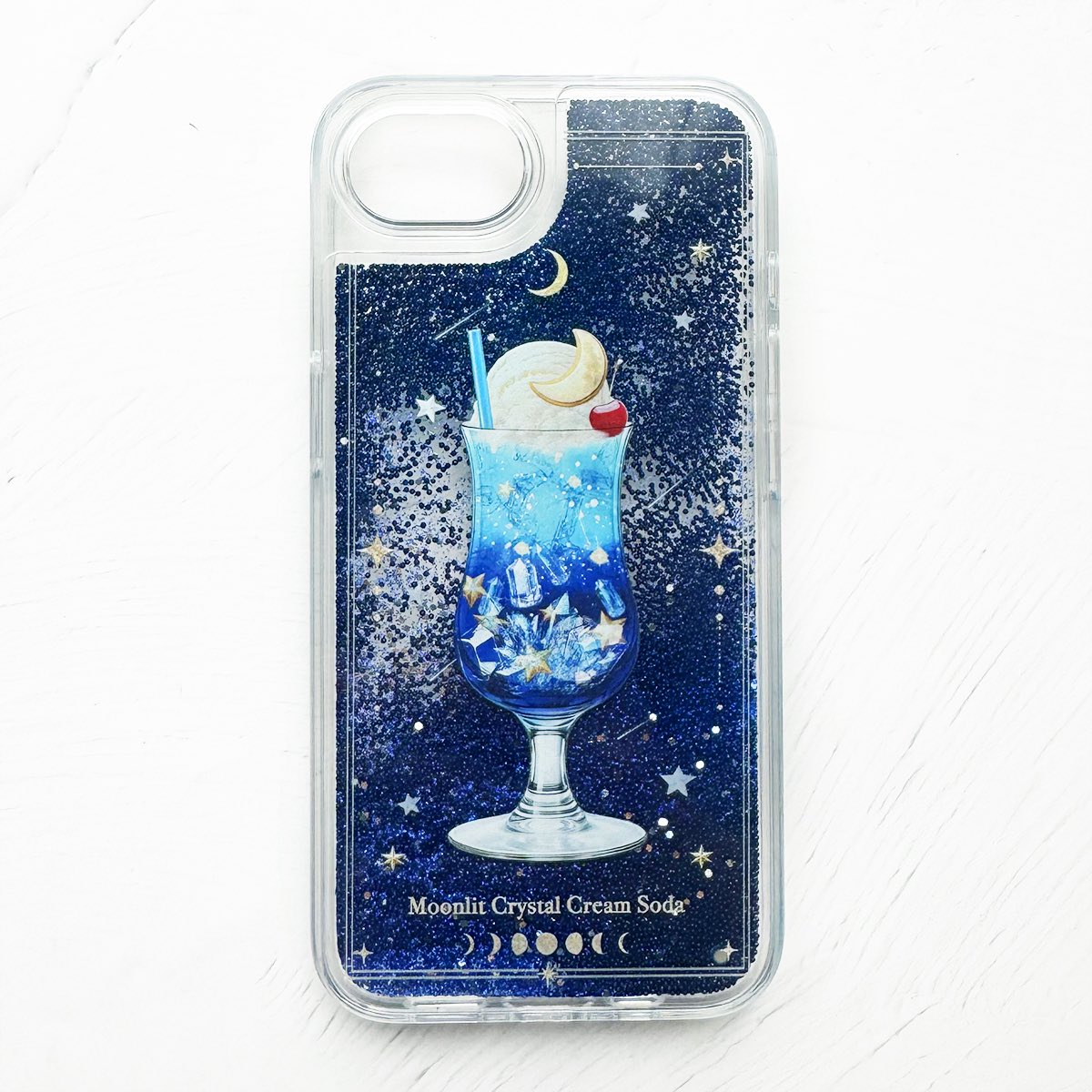 _lalaclover's tweet photo. 星空と鉱物のクリームソーダ
グリッターケースです✨

きらきら揺れるラメと、夜空色のクリームソーダを閉じ込めました🌙
クリームソーダのブルー、メロンソーダ、ヴァイオレットなど色違いもあります。 https://t.co/HDm8OVf7kS