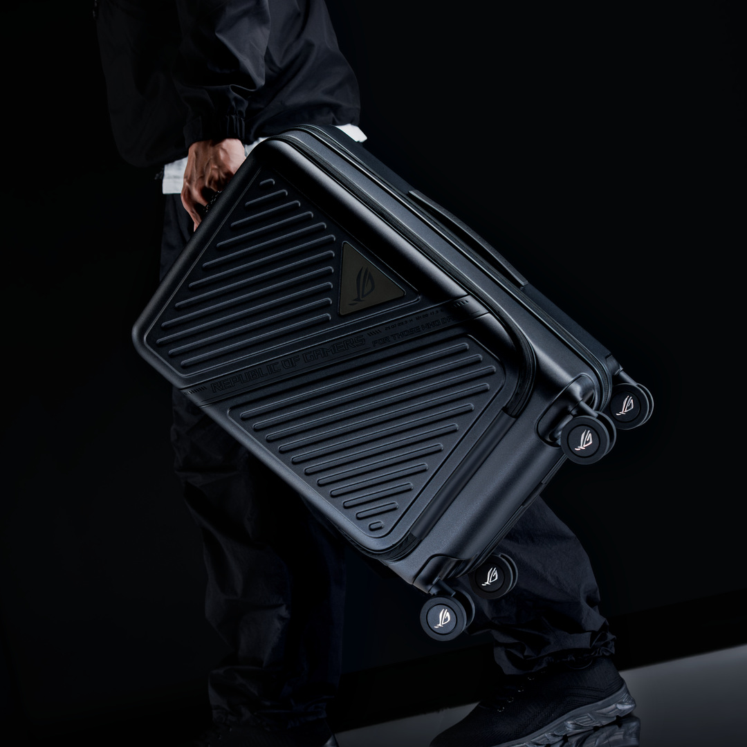 ASUS_ROG's tweet photo. The ROG Archer Suitcase 20 is a 20-inch suitcase sized to fit overhead bins while carrying your laptop, gaming gear, and travel essentials. https://t.co/0D7D9eRkw1
