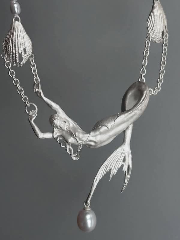 gentleescape's tweet photo. Pearl mermaid statement necklace, bringing an ethereal touch https://t.co/PTcstLX3my