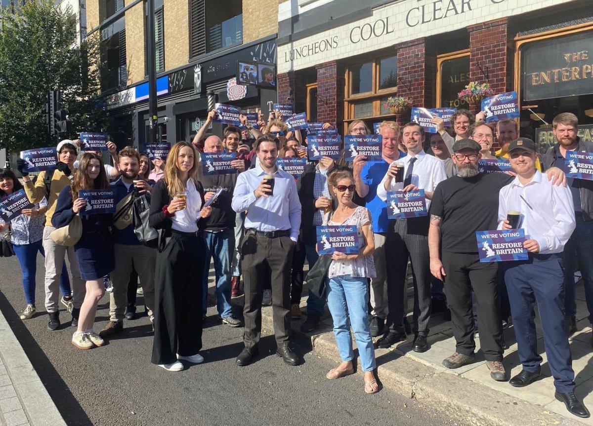 RupertLowe10's tweet photo. Despite the precautions our Holborn and St Pancras campaigning team took today, including hiring private security, moving locations and more, we did think the ‘anti-racist’ mob would somehow turn up to attack and intimidate our action day today.

So we made a plan.

Our campaign manager, @lewisrholmes, knew that he would be targeted again so he volunteered to leave our main group and take the protestors along with him.

It worked. 

They followed and abused Lewis, whilst he attempted to leaflet an area away from the other campaign groups.

The goons, like the thick-minded idiots they are, took the bait and hounded Lewis.

That allowed the rest of our team to continue the campaigning day, which allowed thousands and thousands of leaflets to be delivered.

A big thanks to Lewis, who put it all together, and a huge well done to the team who have contacted thousands of Holborn & St Pancras residents with our message.

Their attack on our team has also led to massive coverage of our campaign messages on social media.

It's an utter disgrace what has happened, but we will not let the mob stop us.

A well deserved pint for the team.