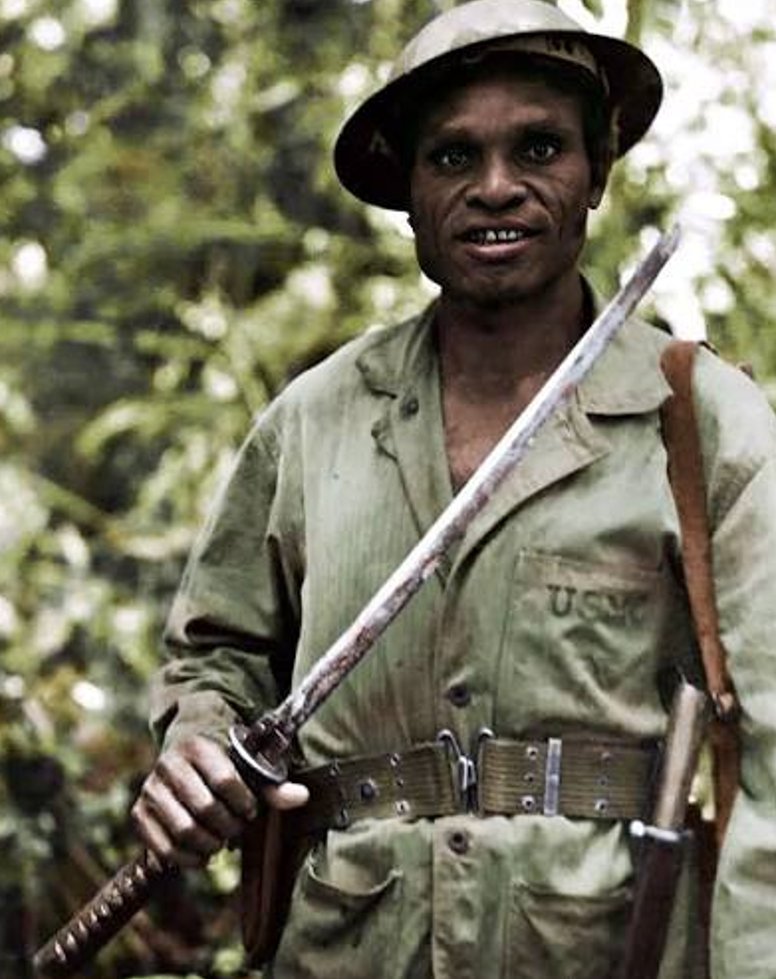 Vanguard_WW2's tweet photo. The Japanese bayoneted him ten times and left him to die.

Four weeks later, he was back behind their lines.

In August 1942, Jacob Vouza was scouting for the 1st Marine Division on Guadalcanal when Japanese soldiers captured him.

They found a small American flag hidden in his clothing, tied him to a tree and demanded information about the Marine defenses.

Vouza refused to speak. An officer slashed him with a sword. Soldiers then drove their bayonets into his face, throat, shoulders and chest.

Convinced that he was dead, they abandoned him.

Vouza chewed through the vines binding him and began dragging himself through the jungle. Bleeding heavily and repeatedly losing consciousness, he finally reached the Marine lines.

He refused medical treatment until he had reported everything he had overheard: hundreds of Japanese soldiers would attack that night, crossing at low tide.

The assault came precisely where and when he had warned.

Surgeons needed nearly 100 stitches to close Vouza’s wounds, along with massive blood transfusions. Yet approximately two weeks later, he walked out of the hospital!

Less than two weeks after that, he became chief scout of the 1st Marine Division.

The man the Japanese had left for dead returned to the jungle, once again locating their positions and leading American patrols behind enemy lines.

Jacob Vouza’s war was far from over.

Follow @Vanguard_WW2 for more extraordinary true stories from World War II.