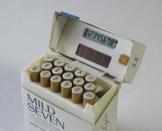 pmamtraveller's tweet photo. A rare, vintage novelty pocket calculator from the late 1990s designed to look exactly like an open pack of Mild Seven Lights cigarettes https://t.co/dxCPK7w2Zi