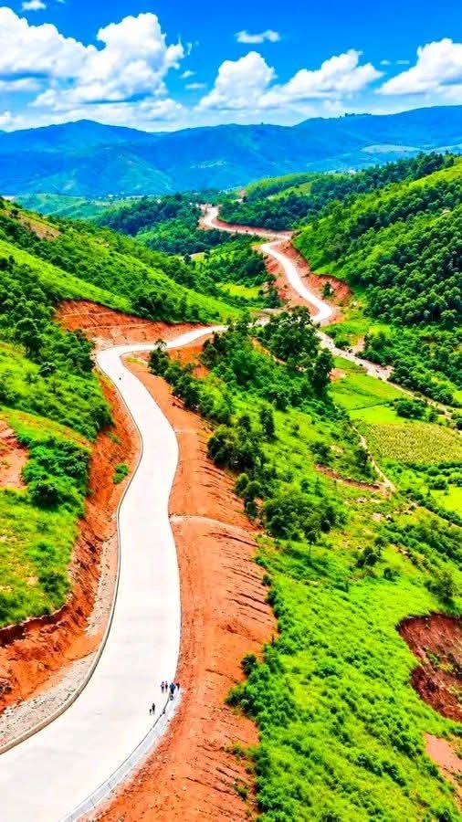 Abdulfagge's tweet photo. No, this is not some far-flung holiday dream location. It's the beautiful Mambilla plateau adorned with the new Gembu–Mbamga–Yang road executed by the Tinubu administration. This life-saving road connects residents of the Mambilla plateau to the Republic of Cameroon border via Donga River on one hand, connects the hilly plateau with the rest of Nigeria, on the other side.

This road has a story, a very historic one.

When Nigeria lobbied communities in this area to vote to be with Nigeria  ahead of the 1961 UN Plebiscite to determine the fate of the old Northern Cameroons, people of this beautiful paradise requested construction of this road among their asks if they were to join Nigeria. They were promised. However that promised remained unfulfilled until the coming of President Bola Ahmed Tinubu who has now changed the story of what was a death trap.

Thank you, Mr President. Arewa na godiya!
#Asiwaju2027 #A4A #ArewaforAsiwaju