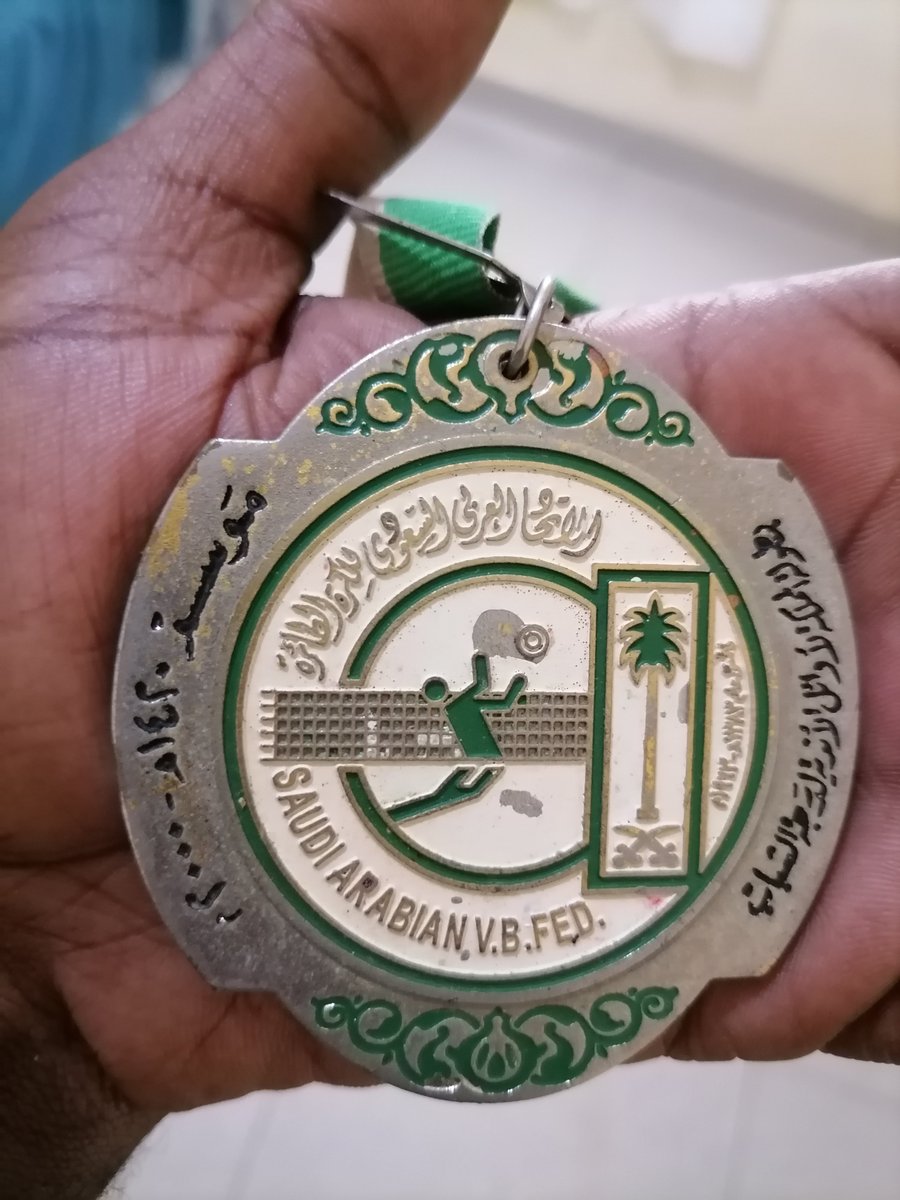 CastroWawa6176's tweet photo. When i saw dad with a lot of medals, i was interested to ask about this one from the kingdom of saudi arabia.

My late father, Harrison Chongo, once told me a story that always amazed me.

While in Saudi Arabia, possibly in Qassim, he attended a volleyball tournament just to watch on their free time.

During the medal ceremony, the King of Saudi Arabia/ King of Saudi arabian volleyball federation if my memory saves me right, reportedly looked into the terraces, recognised my father, pointed at him and told the officials not to give him the medal, but to take it to the Zambian footballer from Al-Taawoun Club  Chongo.

My father was surprised that he was recognised and honoured outside football. It showed him that his name and reputation in Saudi Arabia had reached far beyond the football pitch.

In Zambia, such recognition of our sports personalities and celebrities outside their own field is rare, which makes this story even more special to me.

I have safely kept that medal for many years. It is more than a medal  it is a treasured symbol of the respect and recognition my father earned during his years in Saudi Arabia.

A remarkable honour and a beautiful part of Harrison Chongo’s legacy. 🇿🇲🇸🇦🏅

Who can recall this chapter of the kingdom championship for first division youth league?