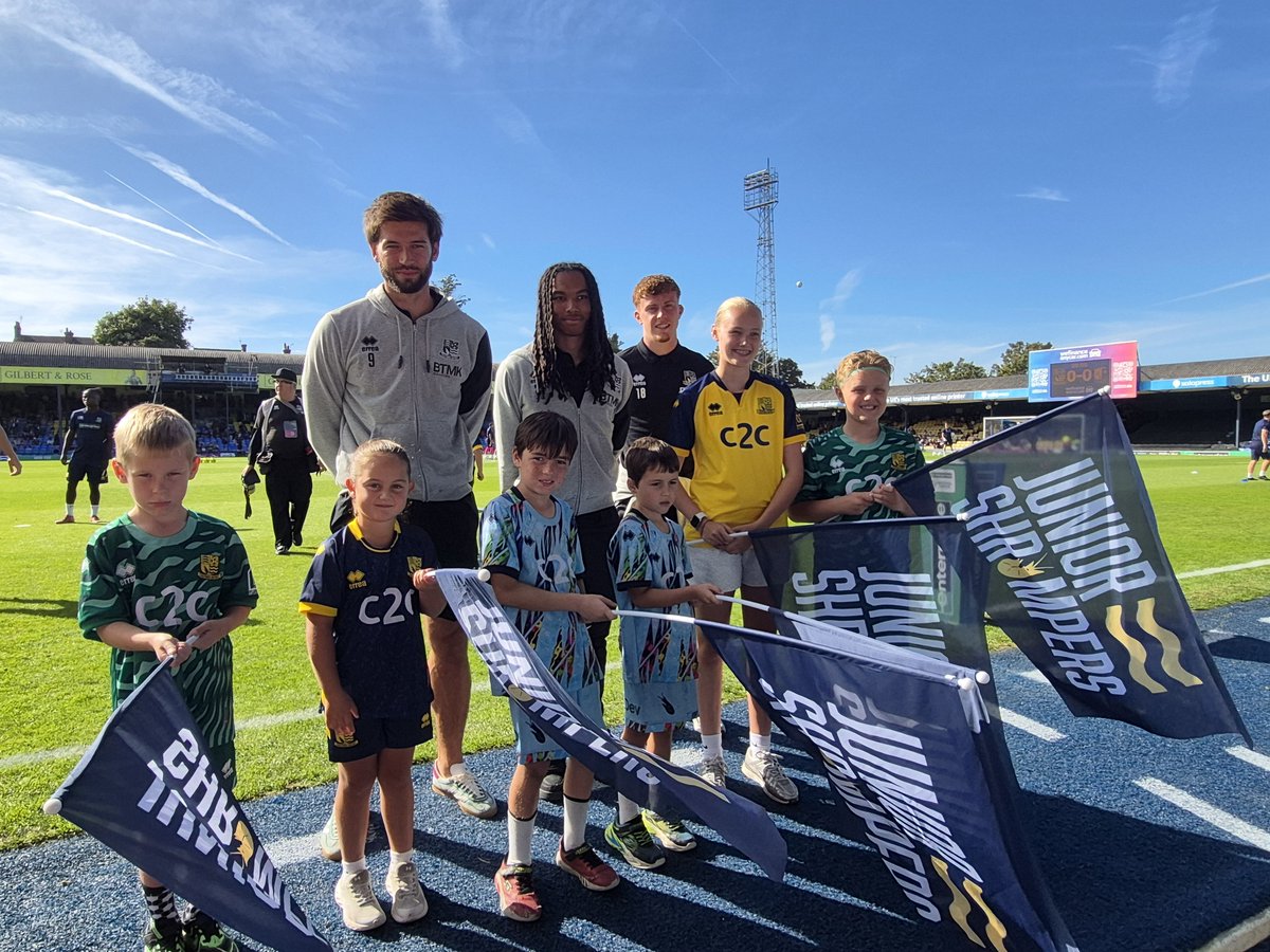 JuniorBlues2's tweet photo. Today's @SUFCRootsHall   #JuniorShrimpers flag bearers - Malakhi, Leo, Aiden, Darcy, Henry and Imogen - with Cards, Rico and new signing Sean Keogh.

#fanexperience 
#fanengagement 
#PioneersDay
#120thanniversary https://t.co/40WDMxYyi7