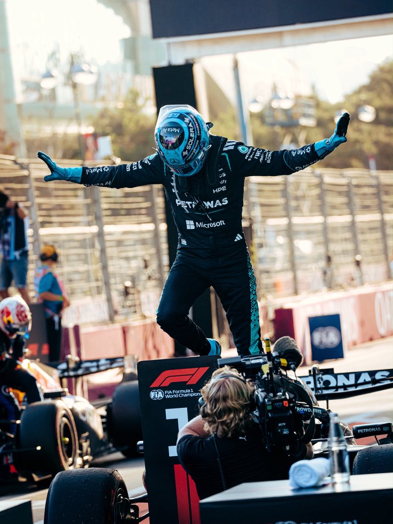 GeorgeRussell63's tweet photo. P1 in Baku and a grand slam!! 🏆🇦🇿 Feels great to be back on the top step of the podium. It’s been a while since the T-pose has made an appearance 😂 
Solid work from the team and thanks to the fans for the love. Feeling energised for the upcoming races. Let’s go, team 👊 https://t.co/BFt0yJmKRN