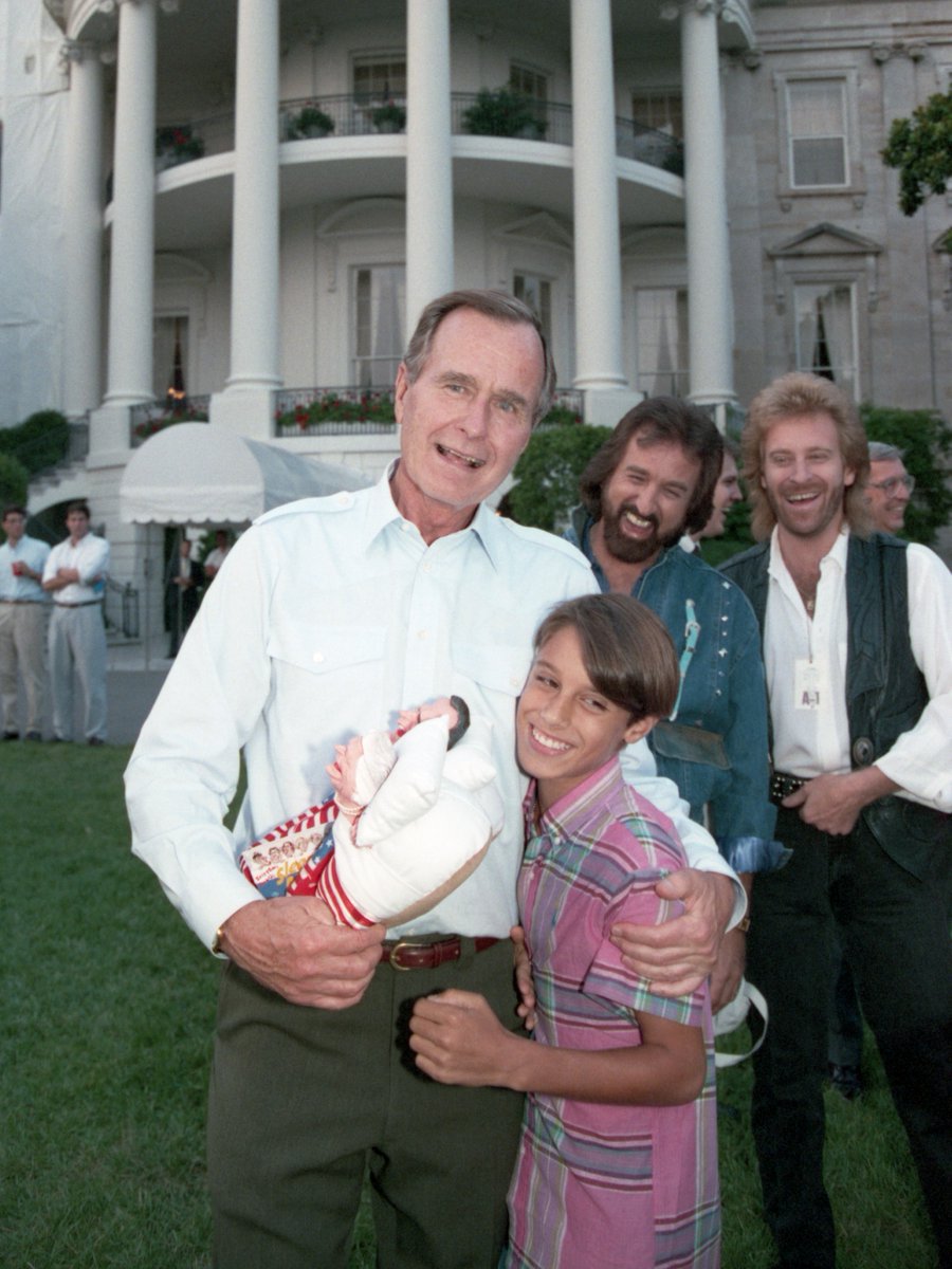 Bush41Library's tweet photo. Come see these slippers, gifted to the Bushes by the Oak Ridge Boys! 

Celebrate 250 years of America at our new 'Gifts of The People: Old Glory' installation, featuring patriotic White House gifts. Open through July 5, 2027!

Photo: August 1, 1989 | IDs: p05444-00a, p05444-03a https://t.co/L7IwWUvYYR