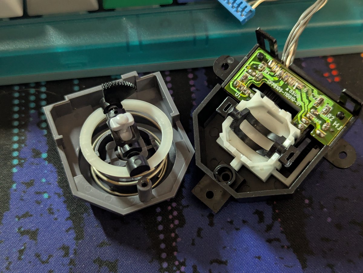 gamrjerome's tweet photo. The module in the gold controller was very clean. The first photo is when I opening it up. I still went though and cleaned all the parts. Lubed with Krytox GLP205. This module will stay OEM. I'll build different one for this controller. I added some #Bones64 Mewtwo buttons https://t.co/XMOb9LS4Up