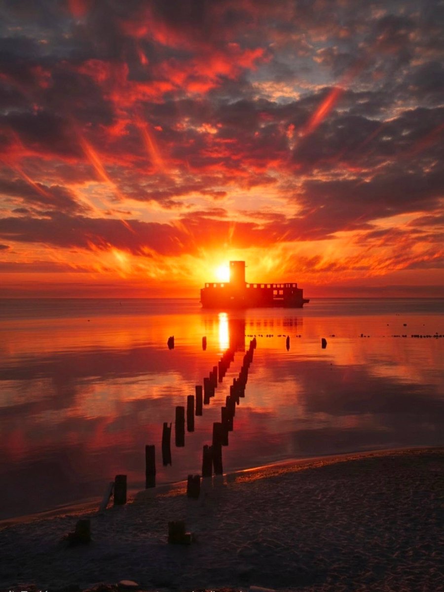 violetrobitgun's tweet photo. A World War II relic—the torpedo station—glowing in the light of the rising sun. Sopot, Gdynia. https://t.co/utrpF7d2KU