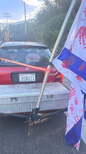 StopAntisemites's tweet photo. When Los Angeles dentist James Rolfe isn’t performing emergency root canals, he’s driving around with an Israeli flag covered in bloody handprints attached to his car, alongside a Palestinian flag.

Dental patients, take note: Emergency After Hours Dentistry might not be the wisest choice for your care.