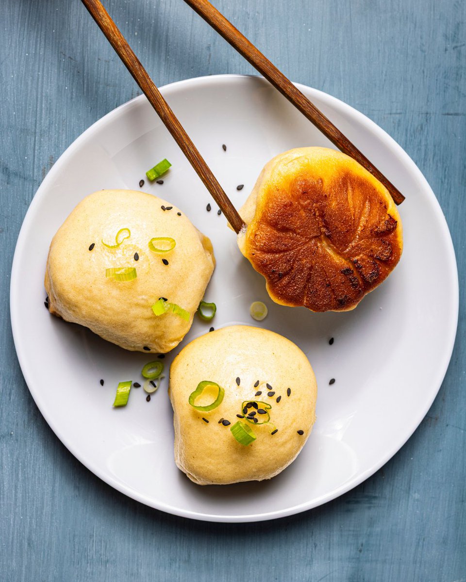 TestKitchen's tweet photo. Crisp on the bottom, fluffy on top, and filled with savory meat and rich broth. Shengjian bao are the weekend project soup season calls for. https://t.co/TjgLRuediF https://t.co/eUknL69Xeh