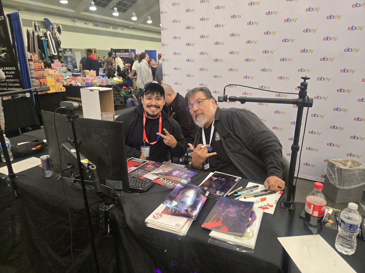 heroinitiative's tweet photo. LIVE NOW: @ToneRodriguez is on @eBay #Live for a Hero Initiative fundraiser at @baltimorecomics!

Jump into the stream, check out the comics and art, and help support comic creators in need: https://t.co/Z01t9zlcdk

#BeTheHero #BCC2026 https://t.co/pbD6TCATNY