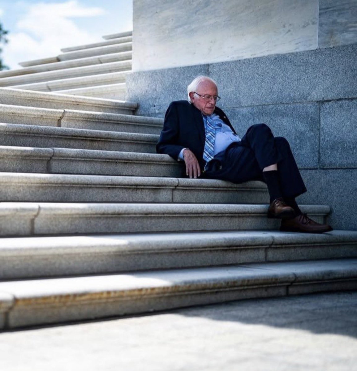 kyamawebb23's tweet photo. Bernie sitting on the Capitol steps alone after his amendment to reduce Medicare drug costs was defeated 99-1. All he's ever done is try his damned hardest to make survival for American workers easier and I wish we deserved him. https://t.co/kSgtRN62tZ