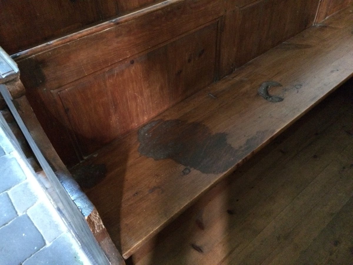 battlefieldexpl's tweet photo. The stains on these benches are blood, and they have been there since June 1944.

The benches stand in the village church of Angoville-au-Plain, Normandy. On 6 June, two medics of the 2nd Battalion, 501st Parachute Infantry Regiment, 101st Airborne Division, Robert Wright and Kenneth Moore, turned the church into an aid station while the fighting swung back and forth outside. Over roughly three days they treated about 80 men, American and German, and a local child. When a German officer asked them to take his wounded as well, they agreed. Both were awarded the Silver Star.

The church is dedicated to Saints Cosmas and Damian, patron saints of physicians. Wright died in 2013 and is buried in its churchyard.