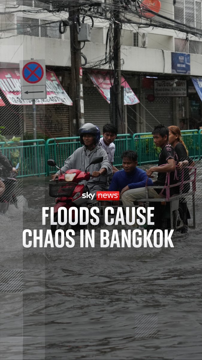 A Sky News report showing people riding a motorcycle through floodwaters in Bangkok, Thailand, with the headline 'FLOODS CAUSE CHAOS IN BANGKOK'.