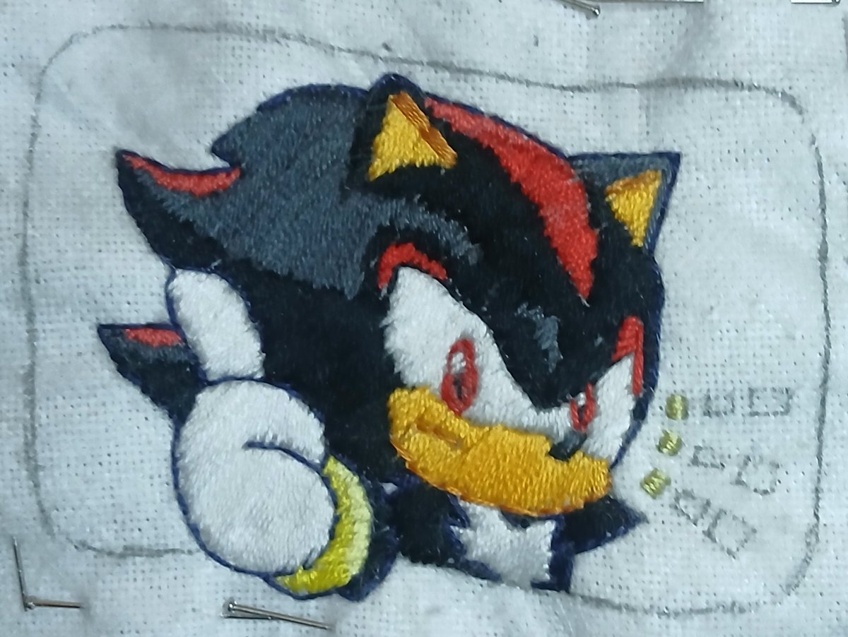 sonicremix's tweet photo. Sneaked in a 5-minute craft session before calling it! 🧵🖤 Added a minor color section to the Shadow embroidery. Eagle-eye test: can anyone actually spot the new color added to the piece? 🔍 #WIP #Embroidery #FiberArt #Crafts https://t.co/ChIvU8lXl2