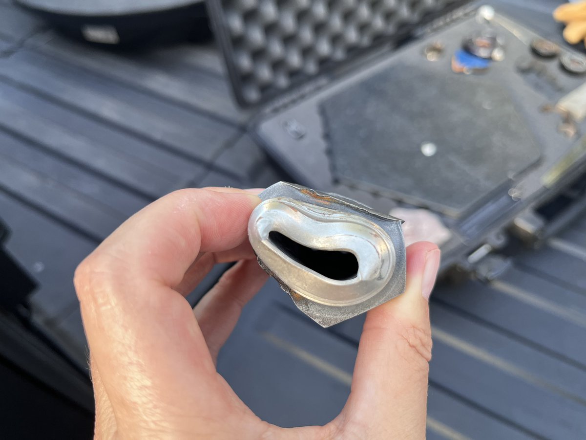AcceleratingTec's tweet photo. I got to hold a SpaceX heat shield tile thanks to @n0rminal that recovered some really interesting parts of SN11, I think. The pressure to create this kind of damage to a connector 😱 https://t.co/nzFpa5i0Vo
