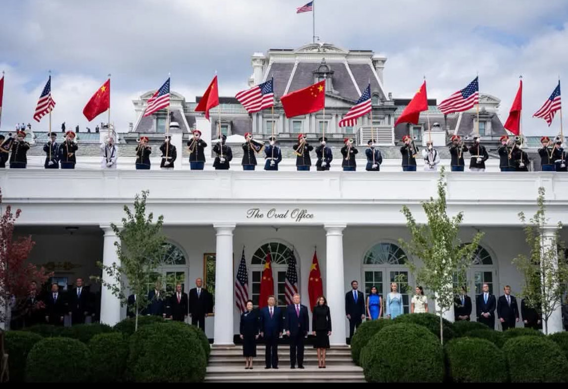 1963Canuck's tweet photo. The gradual humiliation of the U.S. military:

First, it was watching U.S. service members on their hands and knees, nailing down a red carpet for the tender feet of a Russian leader in Alaska.

Then, I watched as U.S. service members were once AGAIN on their hands and knees, nailing down ANOTHER red carpet for the feet of a CHINESE leader in Washington. 

And NOW I see THIS picture of U.S. service members proudly lined up and waving the Chinese COMMUNIST flag, in front of the White House. 

Now I feel something I never felt before, when it comes to the United States military:

Pity.