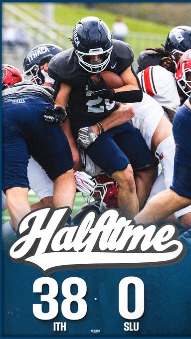 A football player in a dark jersey carrying the ball is tackled by opponents, with a graphic overlay reading 'Halftime 38 - 0 ITH SLU'.