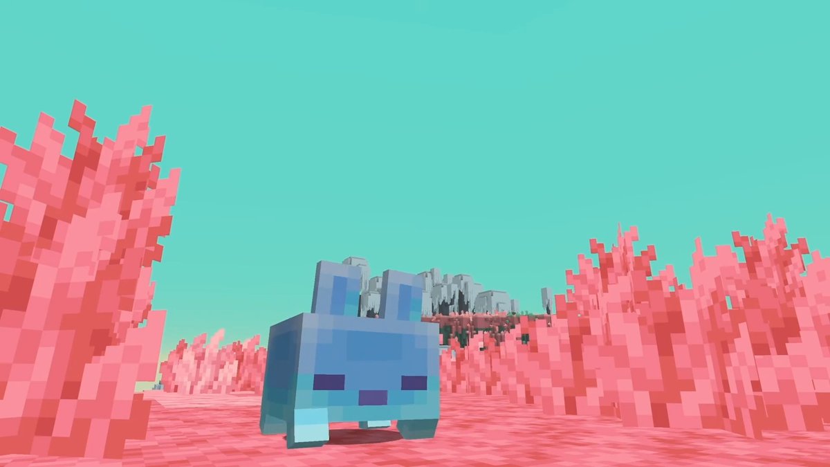 A blue, blocky, pixelated rabbit-like creature stands in a Minecraft-style landscape filled with pink flora under a bright cyan sky.