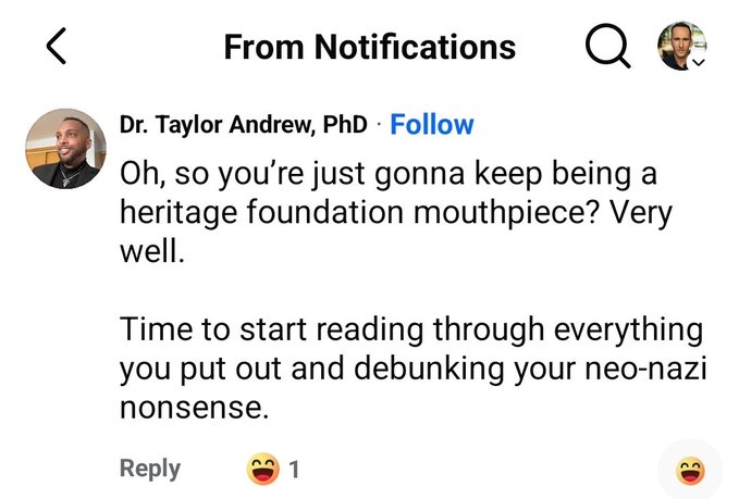 A screenshot from Instagram notifications shows Dr. Taylor Andrew, PhD commenting, "Oh, so you're just gonna keep being a heritage foundation mouthpiece? Very well. Time to start reading through everything you put out and debunking your neo-nazi nonsense." The accompanying post highlights the irony that Dr. Andrew threatened to "debunk" the user's content but immediately blocked them, preventing any actual debate or response.