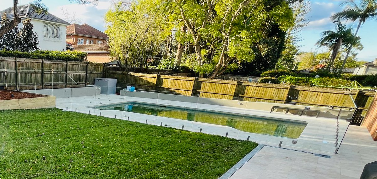 mypoolpainter's tweet photo. Sydney based, Text us @ 0438 553 000  Lawn was removed, new drainage installed, yard levelled,new lawn laid, 46 mtrs of new planter boxes, new &amp; extended paving, frameless glass pool fence.  #landscaping #swimmingpools #paving #backyardmakeover https://t.co/wNKlY3RLhX